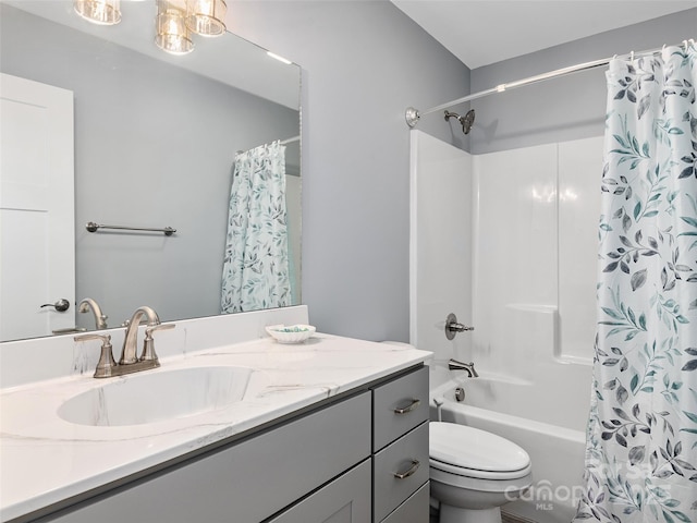 full bathroom with toilet, vanity, and shower / bath combo with shower curtain