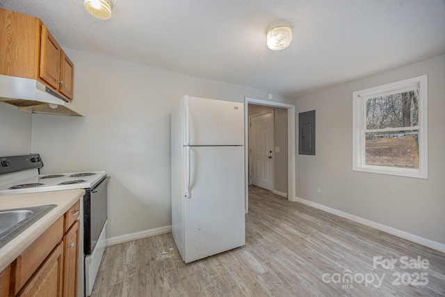 kitchen featuring light hardwood / wood-style flooring, a textured ceiling, white fridge, and electric range