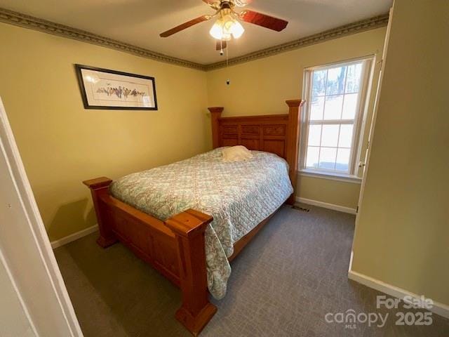 carpeted bedroom featuring ceiling fan and ornamental molding