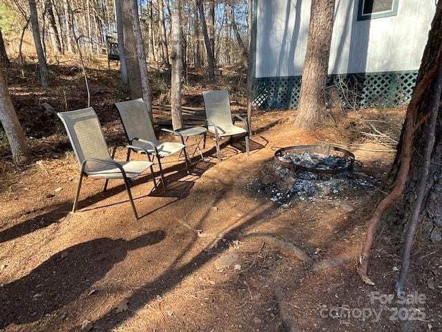 view of patio featuring an outdoor fire pit