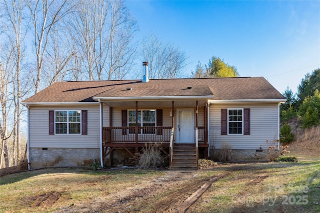 ranch-style house featuring a front yard and covered porch