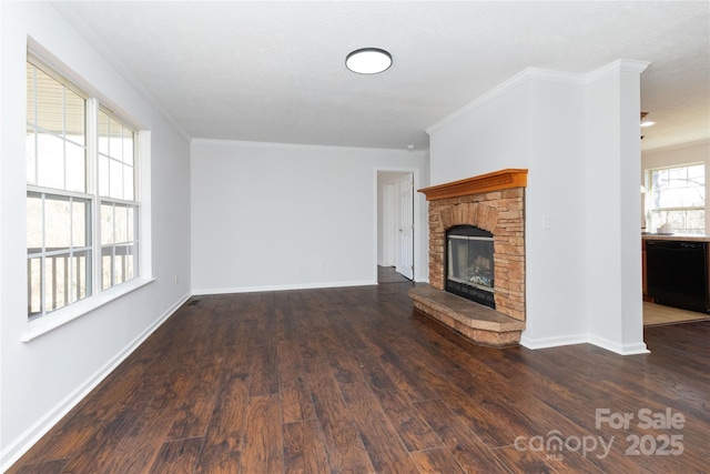 unfurnished living room with crown molding, a fireplace, and dark hardwood / wood-style floors