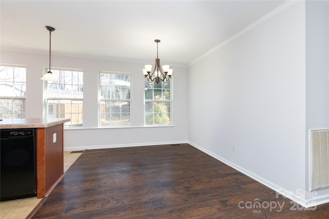 unfurnished dining area with hardwood / wood-style flooring, ornamental molding, and a wealth of natural light