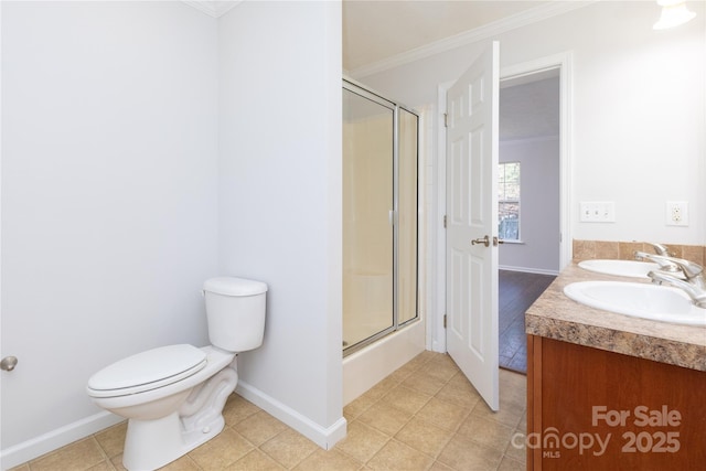 full bathroom featuring tile patterned floors, toilet, crown molding, vanity, and enclosed tub / shower combo