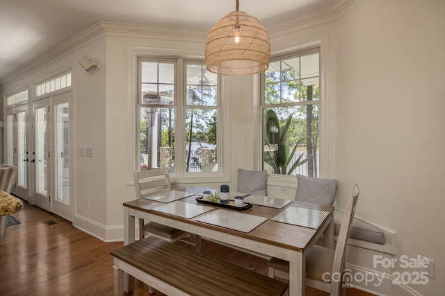 dining space with dark hardwood / wood-style flooring