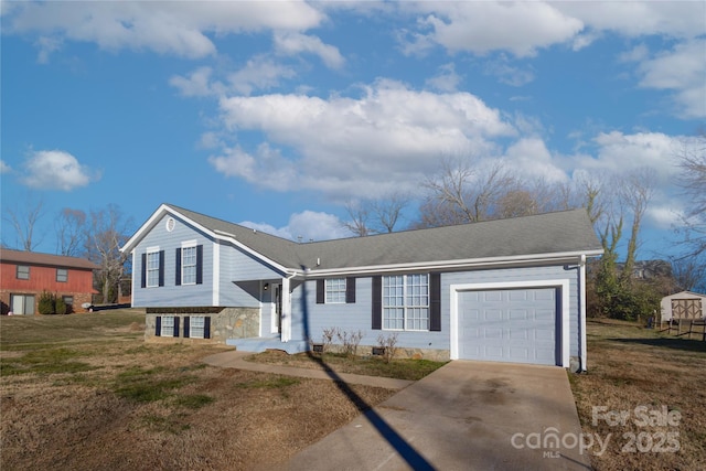 view of front of property with a front yard and a garage