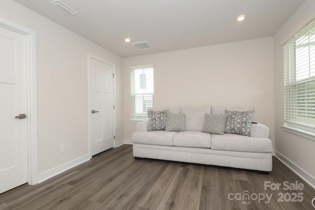 living room with dark wood-type flooring