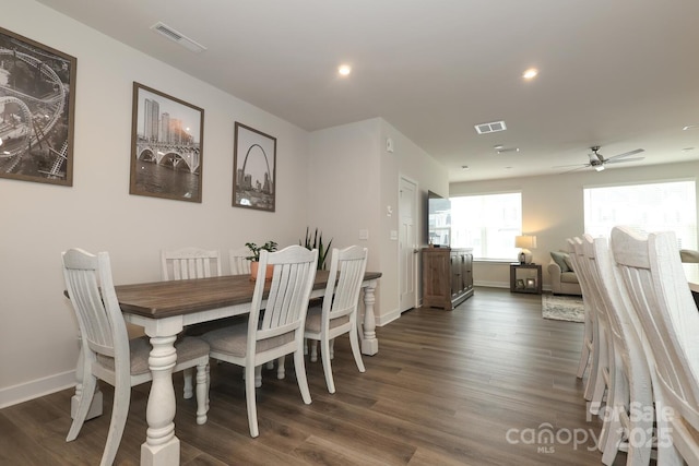 dining space featuring ceiling fan and dark hardwood / wood-style floors