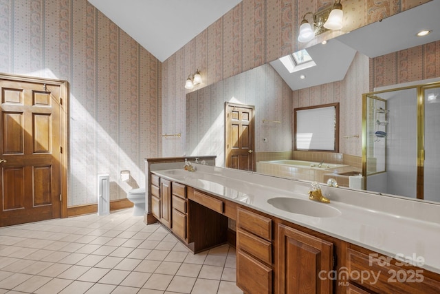 full bathroom featuring lofted ceiling with skylight, a stall shower, wallpapered walls, and a sink