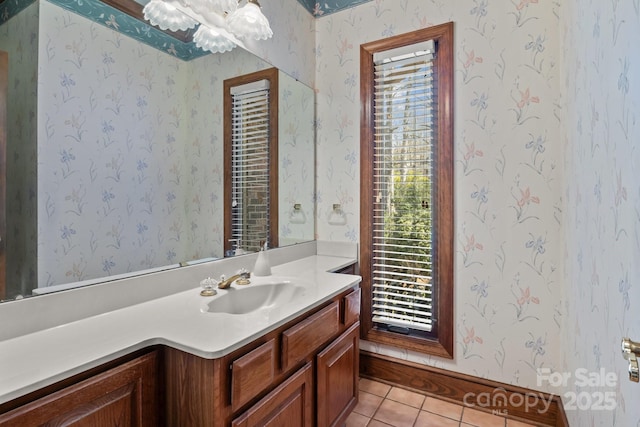 bathroom with wallpapered walls, tile patterned floors, and vanity