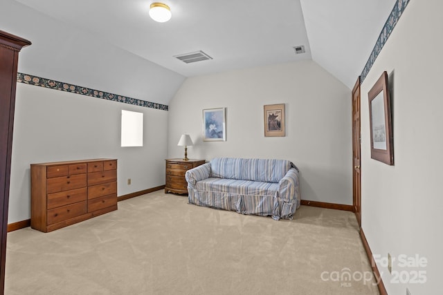 sitting room with visible vents, light carpet, baseboards, and vaulted ceiling