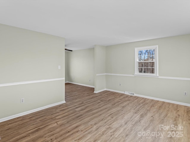 empty room featuring hardwood / wood-style flooring