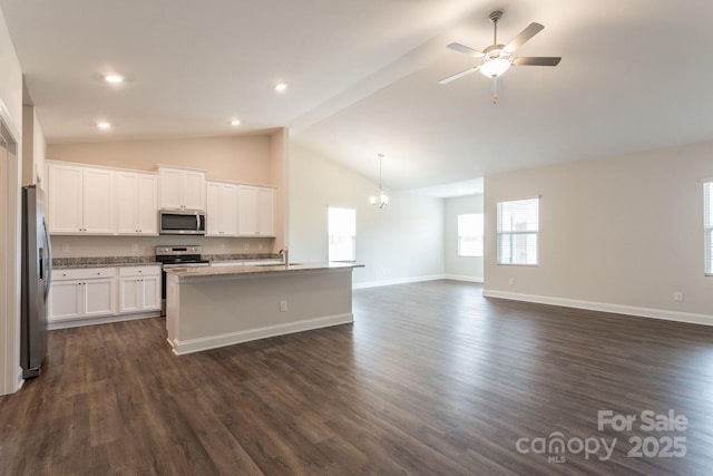 kitchen with dark hardwood / wood-style floors, a center island with sink, sink, white cabinetry, and appliances with stainless steel finishes