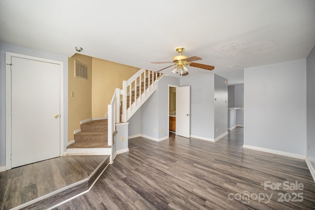 unfurnished room with dark hardwood / wood-style floors and ceiling fan