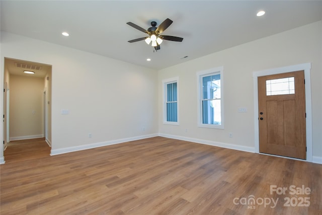 foyer featuring ceiling fan and light hardwood / wood-style floors