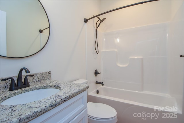 full bathroom featuring toilet, vanity, and shower / tub combination