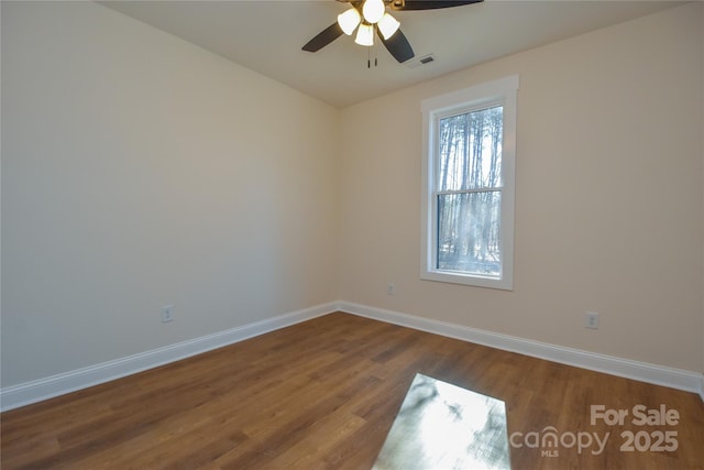 unfurnished room featuring ceiling fan and hardwood / wood-style floors