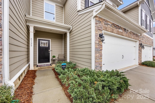 property entrance with a garage