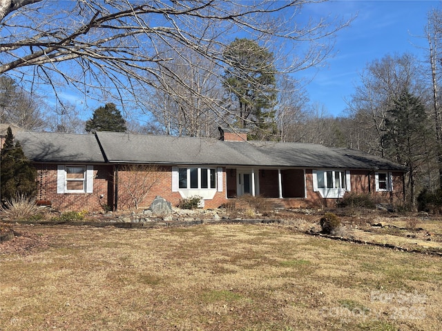 back of house featuring a yard