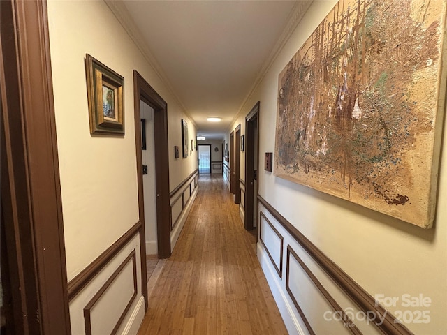 corridor featuring crown molding and dark wood-type flooring