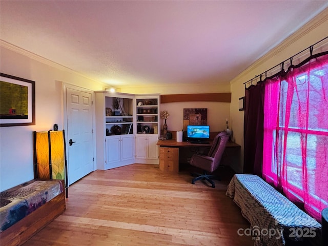 office area featuring crown molding and light wood-type flooring