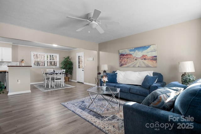 living room with ceiling fan and wood-type flooring