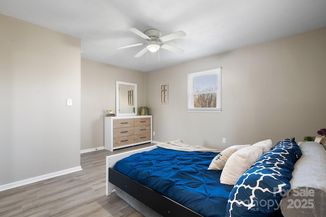 bedroom featuring ceiling fan and light hardwood / wood-style floors