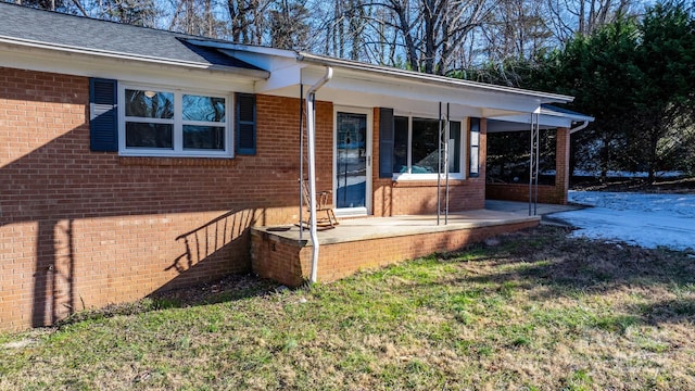 exterior space with a lawn and covered porch