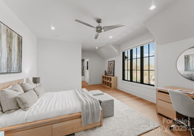 bedroom featuring light wood-type flooring, baseboards, and recessed lighting