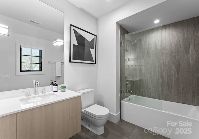 full bathroom featuring visible vents, toilet, tile patterned floors, tub / shower combination, and vanity