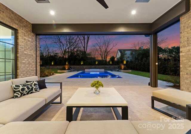 view of pool at dusk