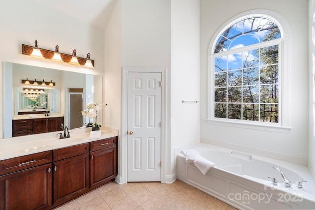 bathroom featuring tile patterned floors, separate shower and tub, and vanity