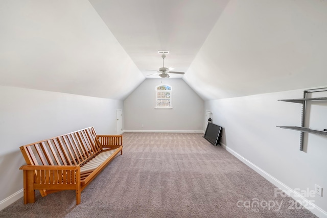 unfurnished room featuring light carpet, ceiling fan, and vaulted ceiling