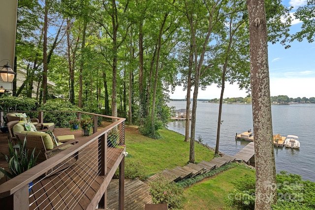 dock area featuring a yard and a water view