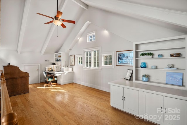 office area featuring ceiling fan, vaulted ceiling with beams, and light wood-type flooring