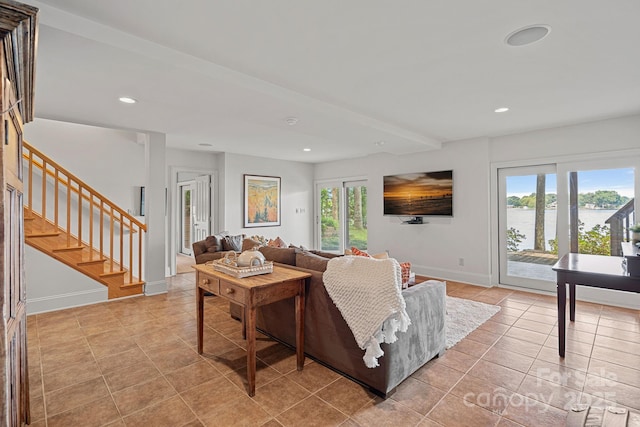 tiled living room featuring plenty of natural light