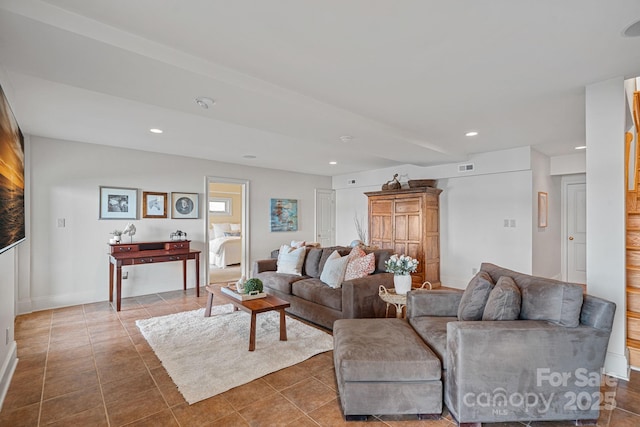 living room with dark tile patterned flooring