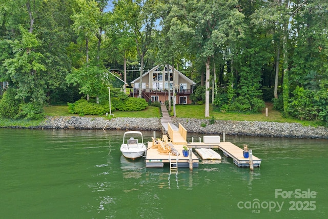 view of dock with a deck with water view