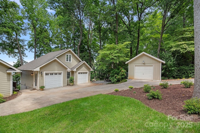 view of front of home featuring a garage and an outdoor structure