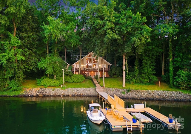 dock area featuring a water view and a yard