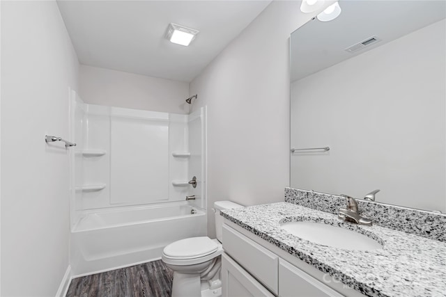 full bathroom featuring toilet, shower / bath combination, hardwood / wood-style floors, and vanity