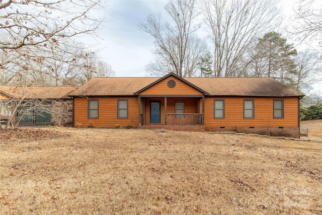 view of front of property with a porch and a front lawn