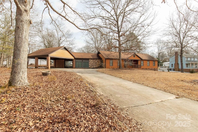 single story home featuring a carport