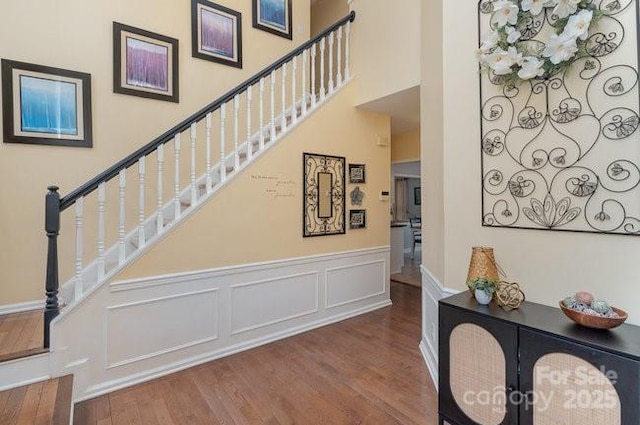 stairway featuring hardwood / wood-style floors