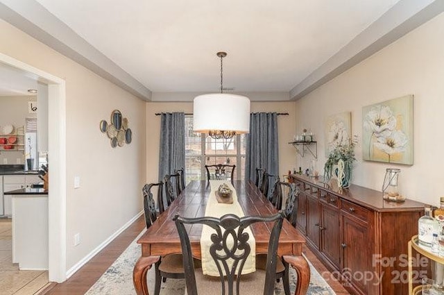 dining area with hardwood / wood-style flooring