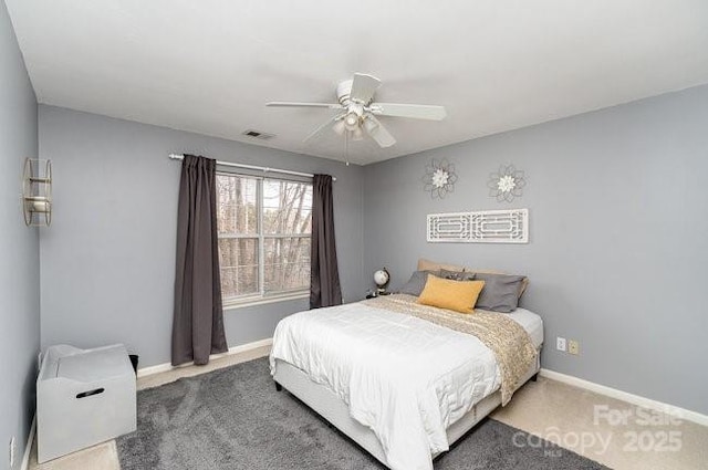 carpeted bedroom featuring ceiling fan