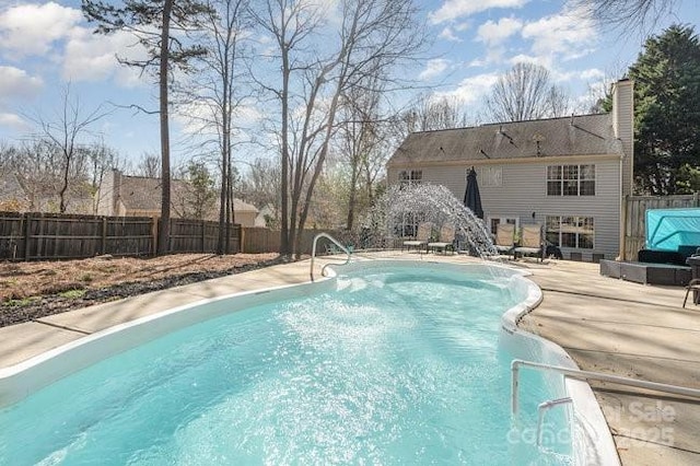 view of pool featuring a patio