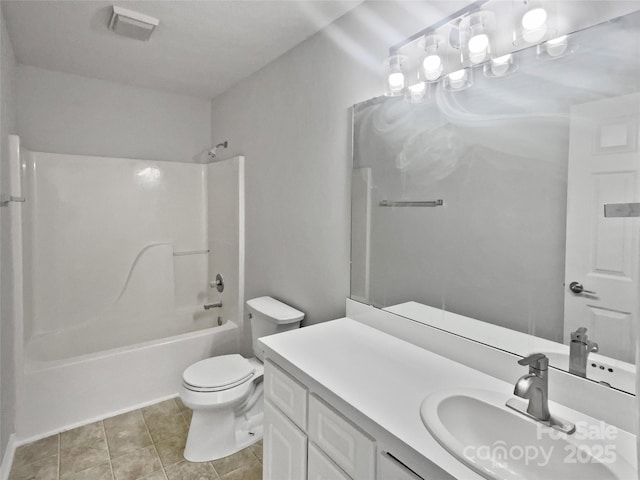 full bathroom featuring toilet, vanity, tub / shower combination, and tile patterned floors