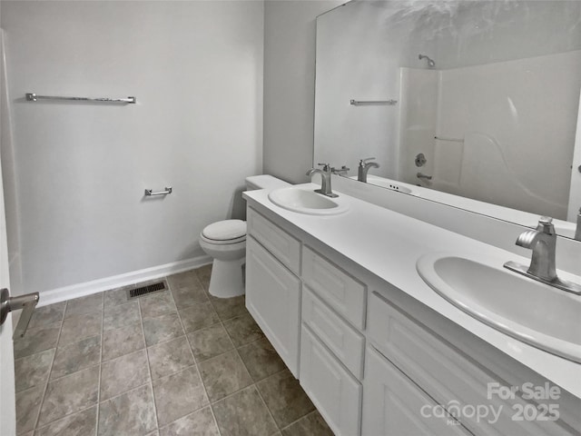 full bathroom featuring toilet, vanity, and tub / shower combination