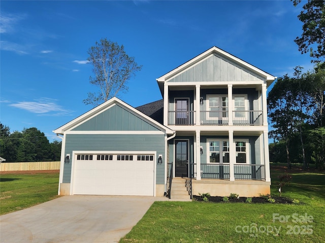 8078 Blackwood Rd, Denver, NC 28037 - view of front of property with a balcony, covered porch, an attached garage, concrete driveway, and board and batten siding